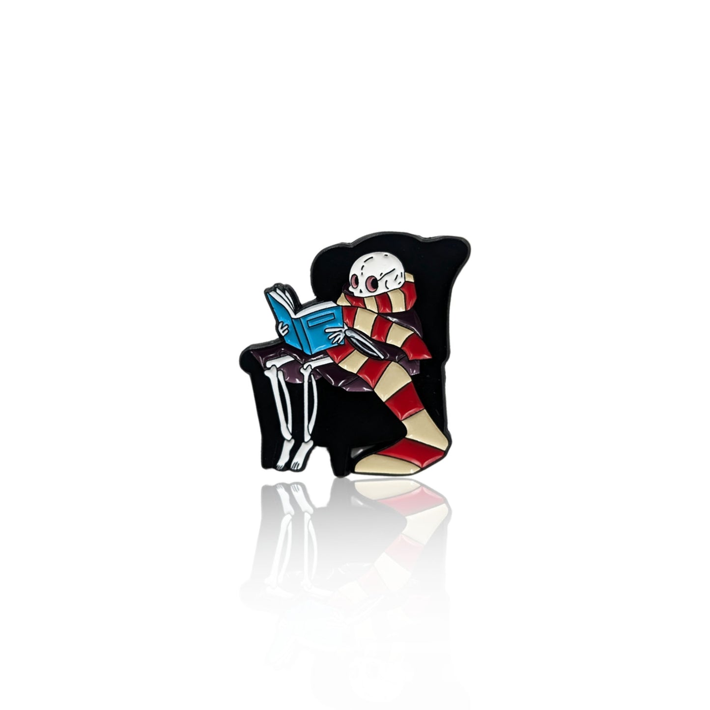 Cozy Skeleton Reading a Book enamel pin