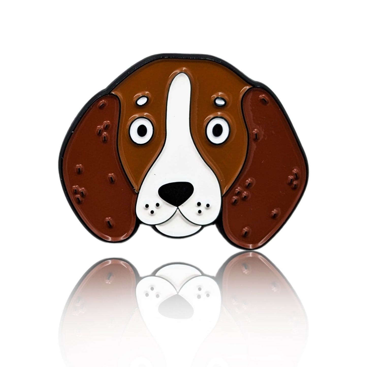 Enamel pin of a cartoon Basset Hound face with long ears and wide eyes