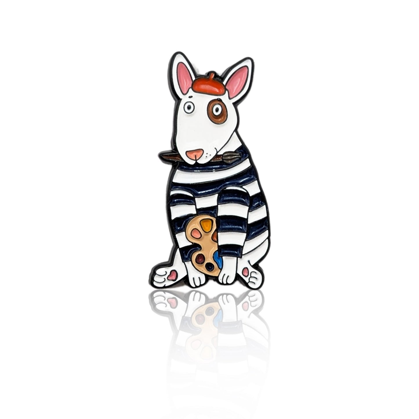 Enamel pin of a cartoon Bull Terrier dressed as an artist with a beret, paint palette, and brush