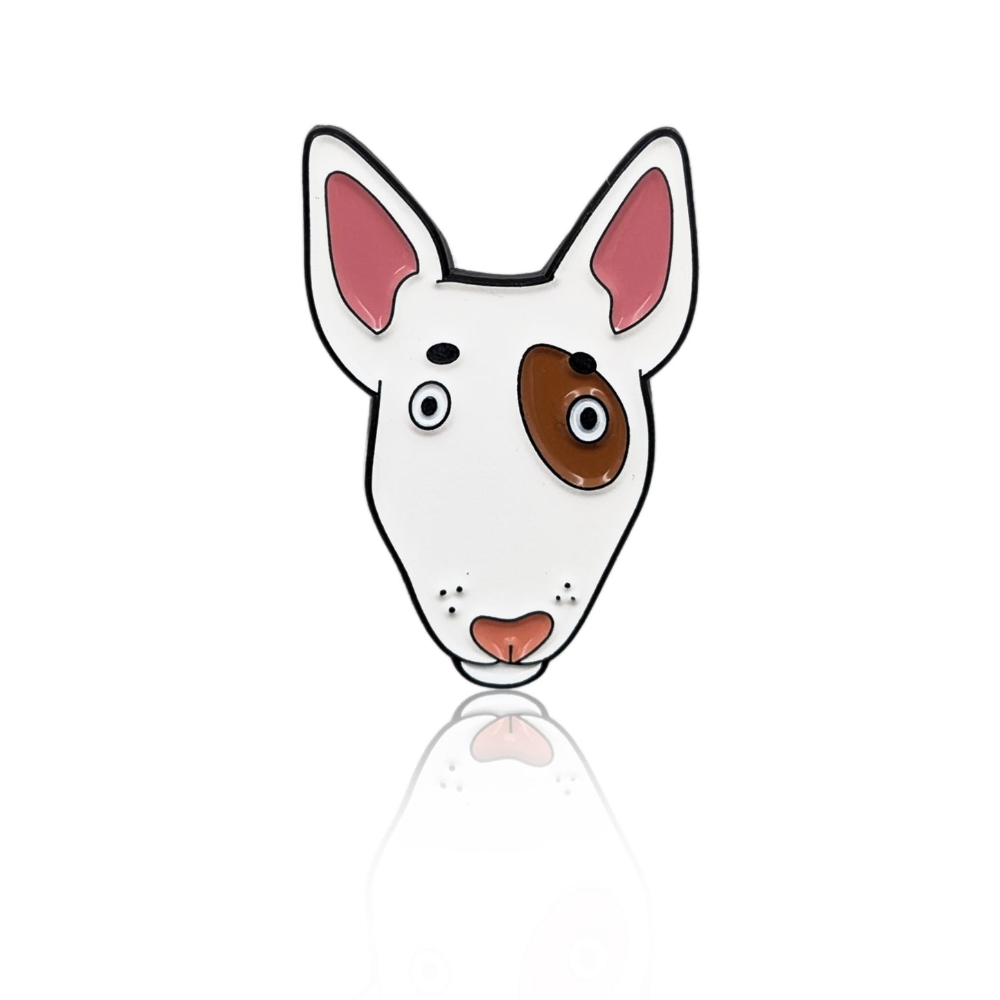 Enamel pin of a cartoon Bull Terrier face with a brown eye spot and pink nose