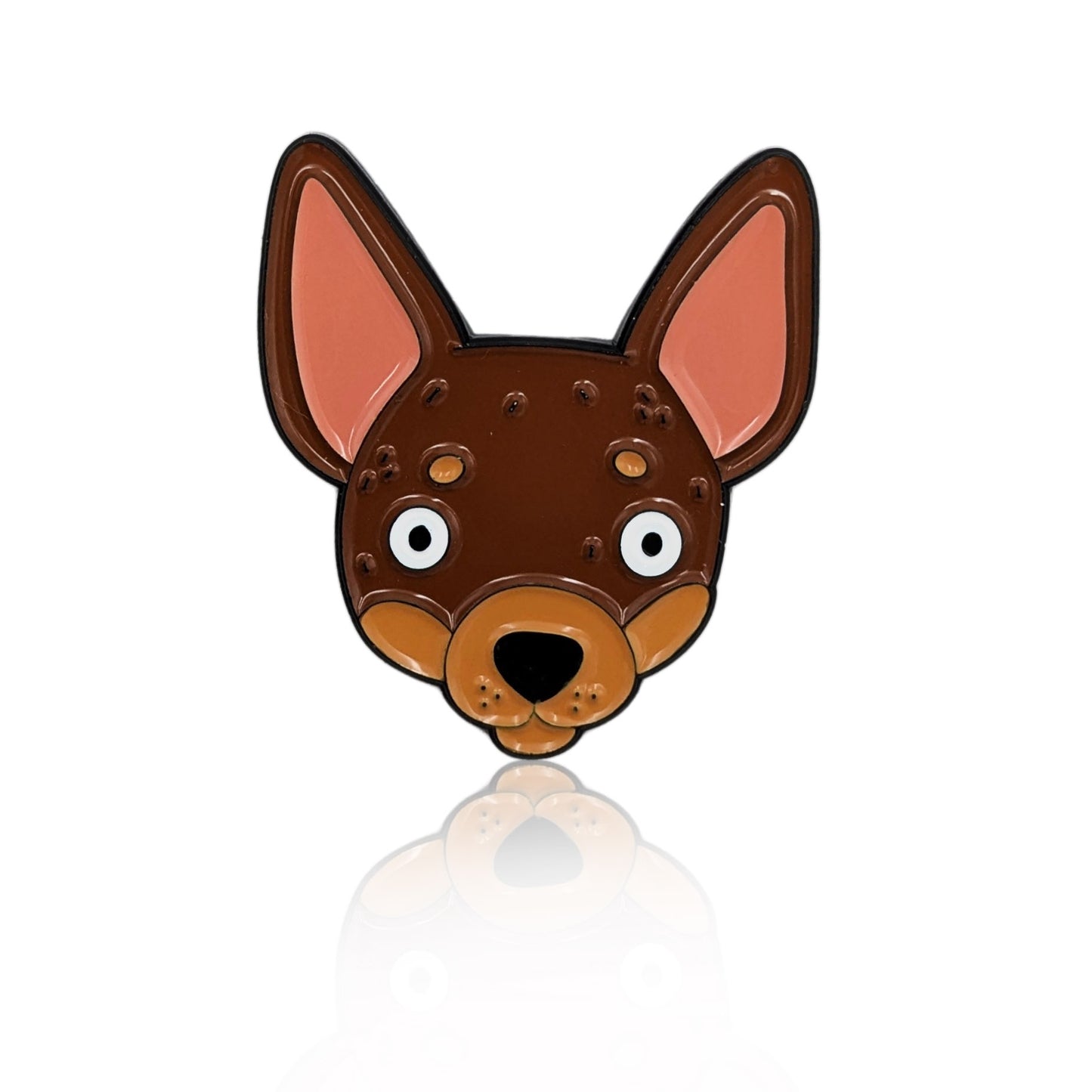 Enamel pin of a cartoon Chihuahua face with big ears and wide eyes