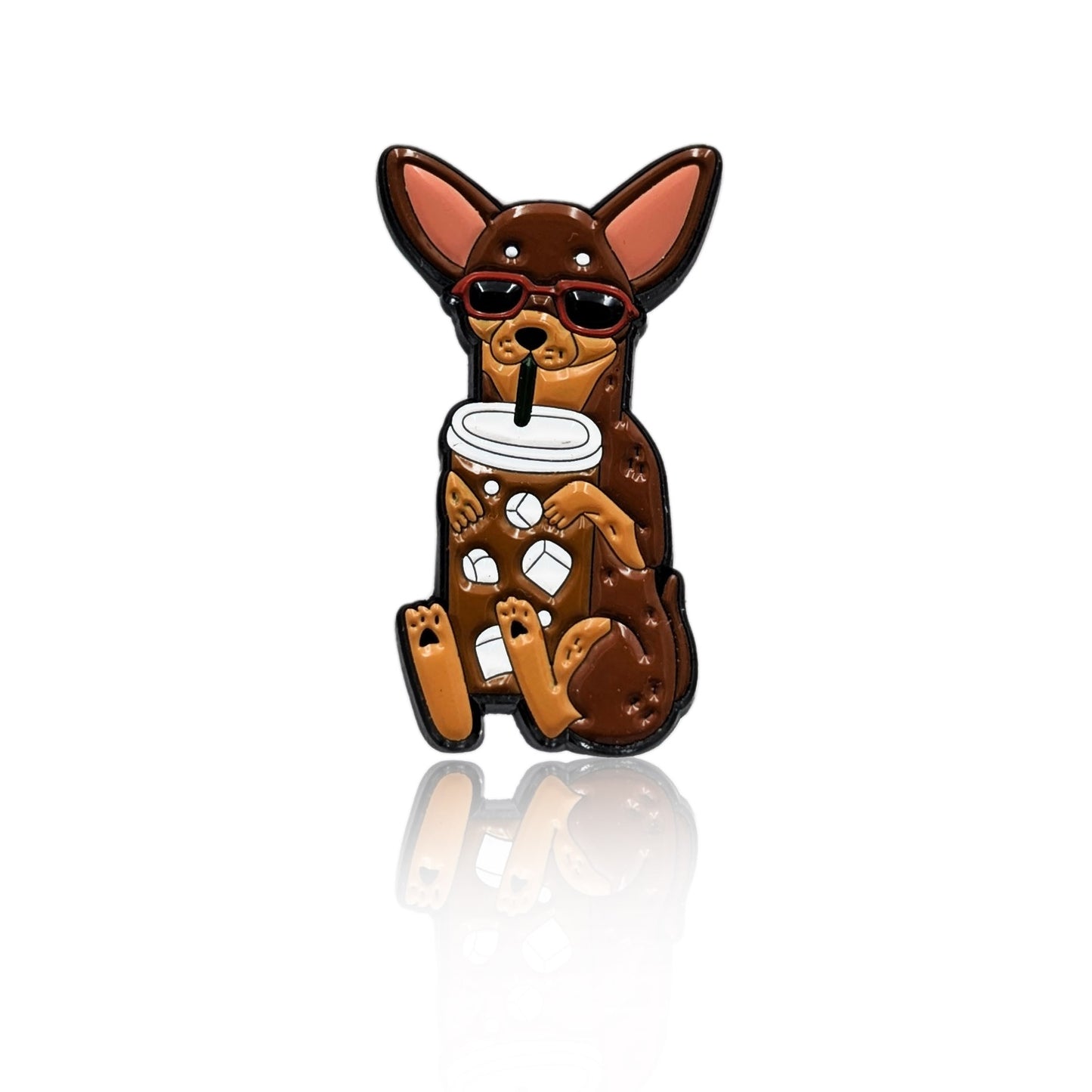 Enamel pin of a cartoon Chihuahua in sunglasses holding an iced coffee with a straw