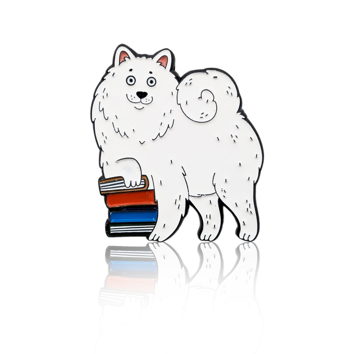 Enamel pin of a cartoon Samoyed dog with a paw on a stack of books