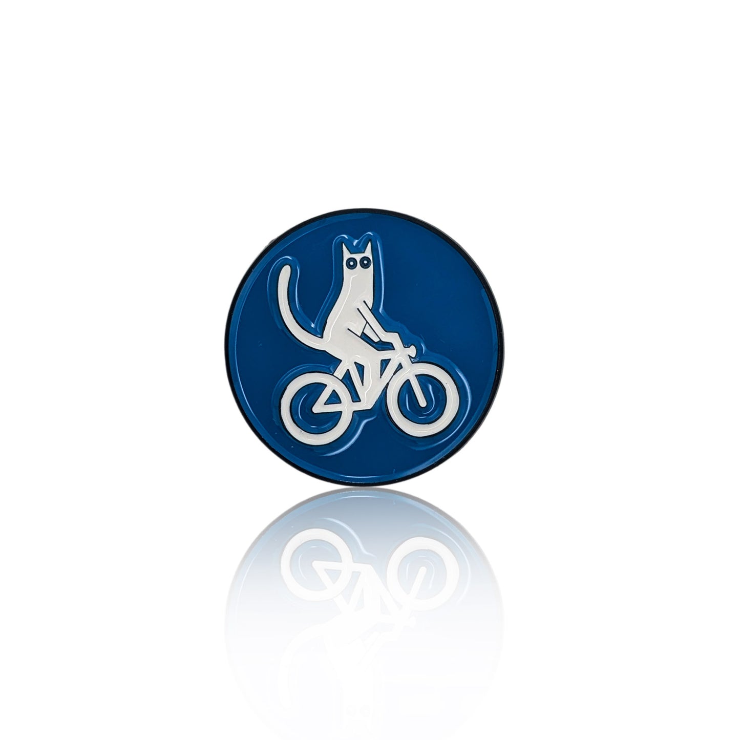 White cat on a bicycle enamel pin