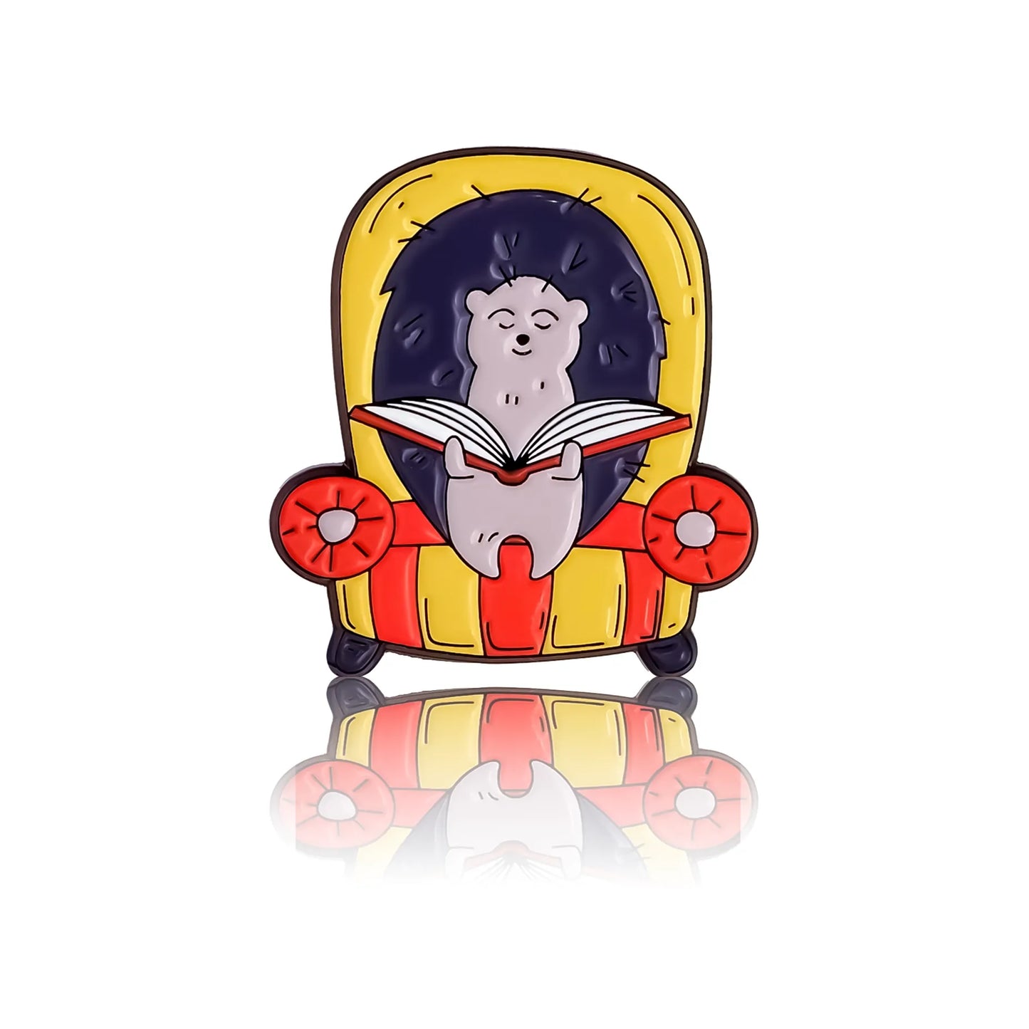 Hedgehog reading a book in a yellow-red armchair, enamel pin in Canada