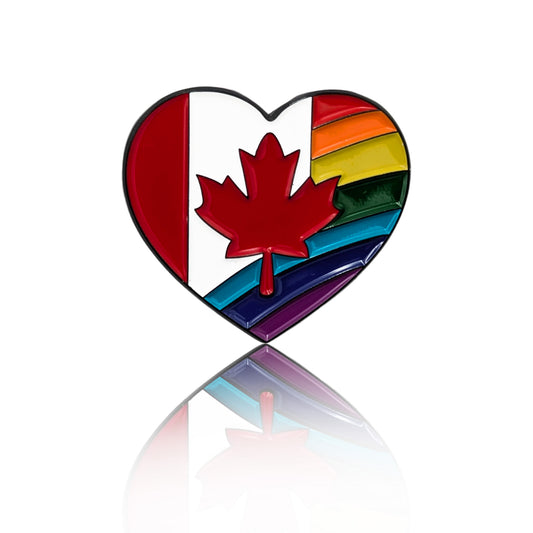 Heart-shaped enamel pin with a red maple leaf centered between half of the Canadian flag and rainbow Pride stripes