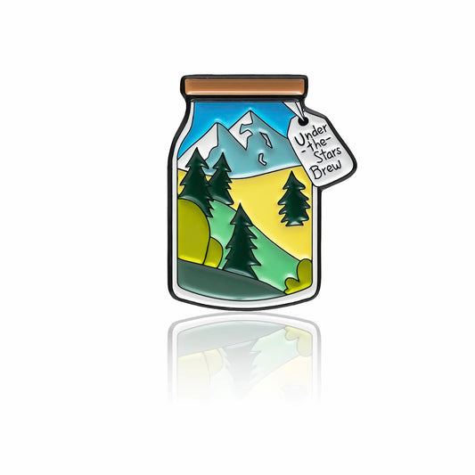 Mountain landscape enamel pin in jar shape with Under the Stars Brew tag 32mm by PINBOX