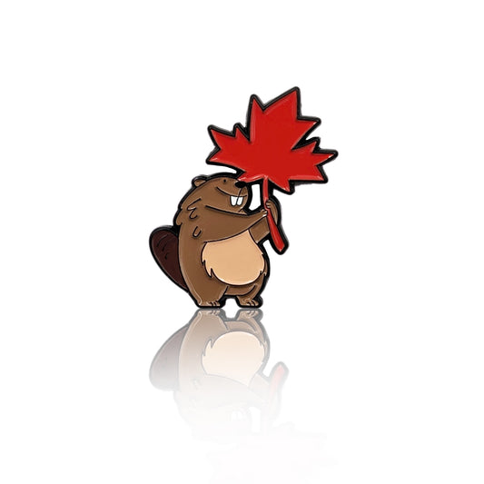 Cute beaver enamel pin holding a red maple leaf, inspired by Canada, shown on a clean white background