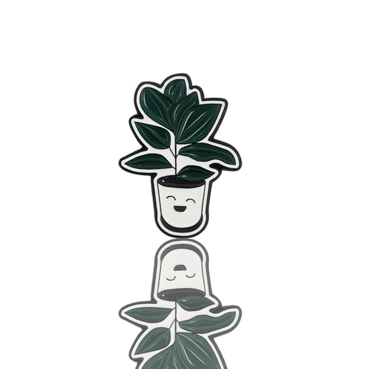Cute enamel pin of a smiling potted houseplant with dark green leaves on a white background