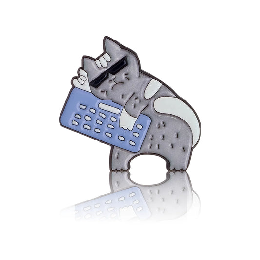 Gray cat in glasses with a keyboard