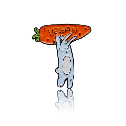 Rabbit holding a carrot with a vegan sign