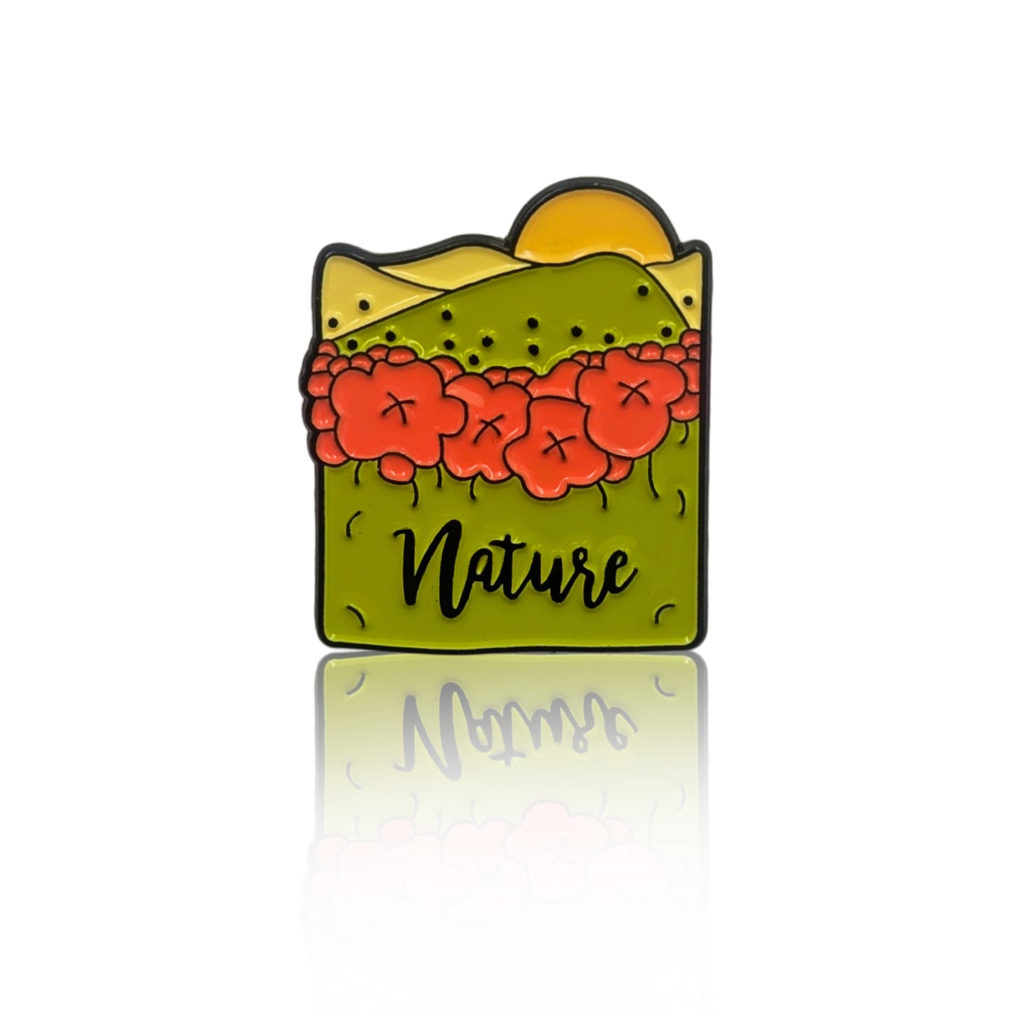 Nature-themed enamel pin with flowers, rolling hills, and sun illustration, shown on a white background