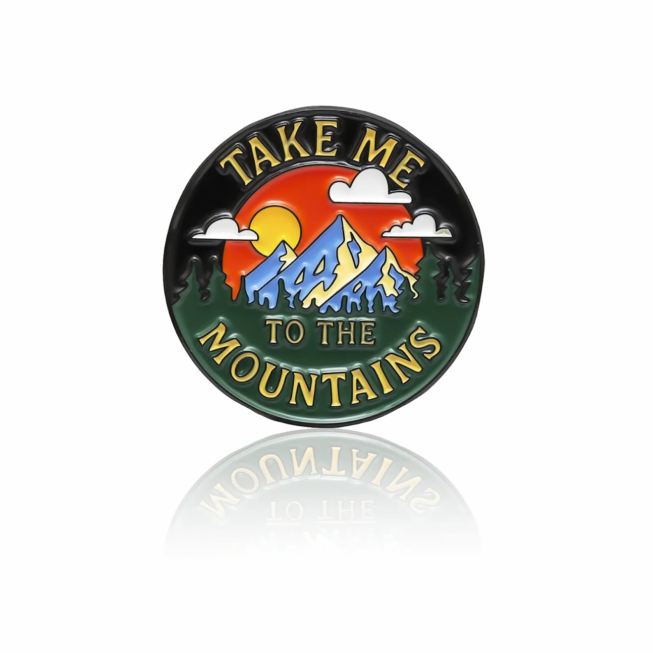 Mountain enamel pin with sunset, trees, clouds, and text “Take Me to the Mountains,” 32mm by PINBOX