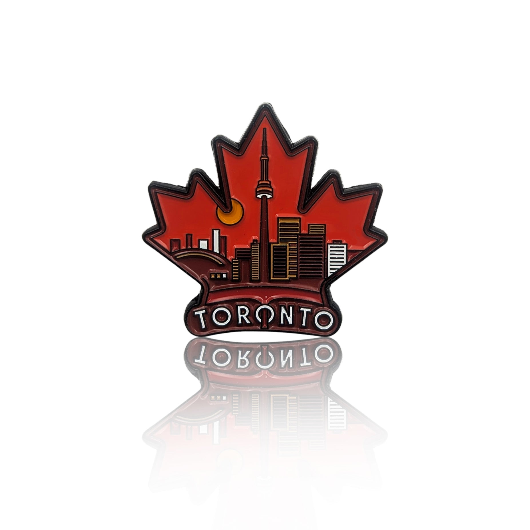 Red maple leaf enamel pin with Toronto skyline and CN Tower, shown on a clean white background